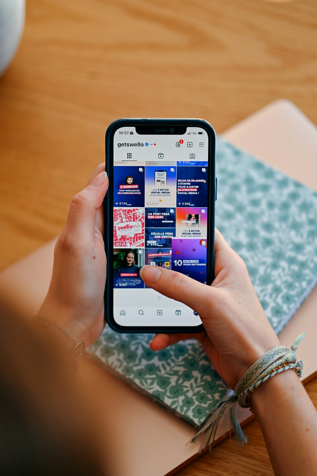 services-02 hands-holding-phone-displaying-social-media-feed-7ljc7nkjncc